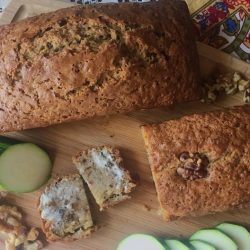 Banana bread with nuts on breadboard