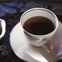 Coffee beans and china cup and saucer